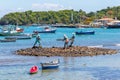 Buzios, Rio de Janeiro. Bronze sculpture Three fishermen placed in the bay of buzios.